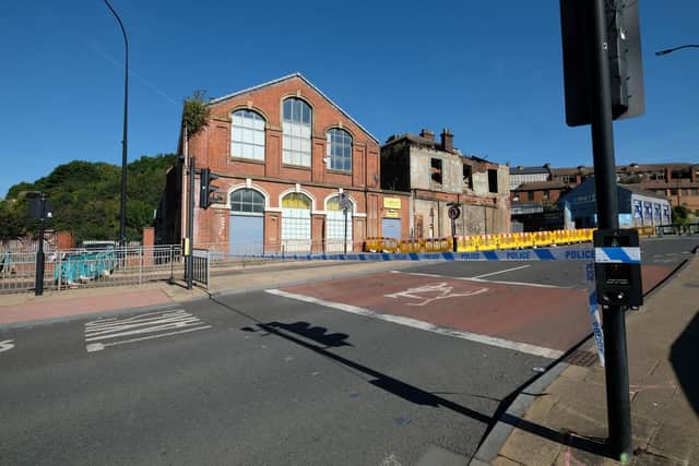 Officials admit they still cannot say when Spital Hill, Sheffield, will re-open after a suspected arson attack left a building in a dangerous state.