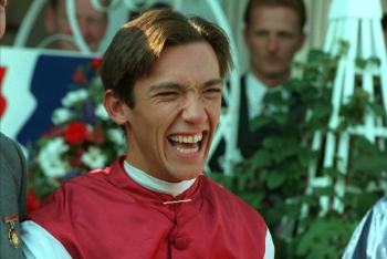 Frankie Dettori won the St Leger in 1996 - here he is with a big grin on his face.
