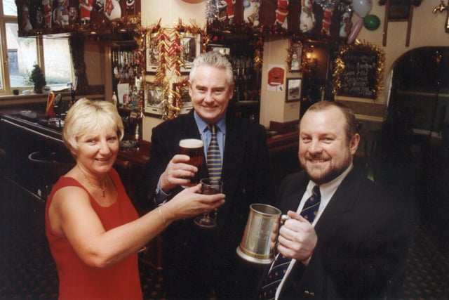 White Rose Inns managing director Tim Drake (centre) toats the purchase of his company's 45th pub with hosts Nigel Ball and Angela Holdsworth at The Windmill, Thorne, Doncaster in 2000