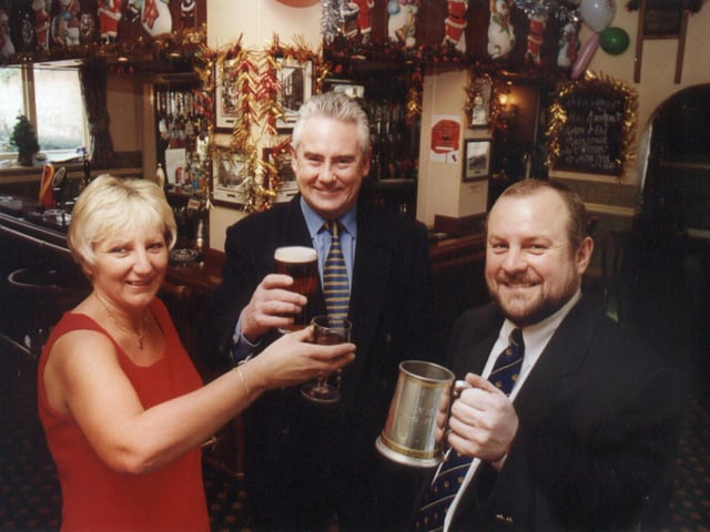 White Rose Inns managing director Tim Drake (centre) toats the purchase of his company's 45th pub with hosts Nigel Ball and Angela Holdsworth at The Windmill, Thorne, Doncaster in 2000