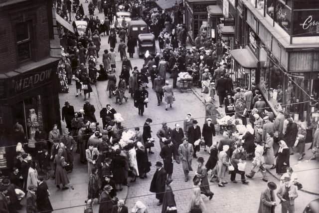 Dixon Lane, Sheffield in 1950
Caption reads "There's something lively and "matey" about a shopping crowd.  Let's keep the town alive a little later, on Saturday's at any rate".