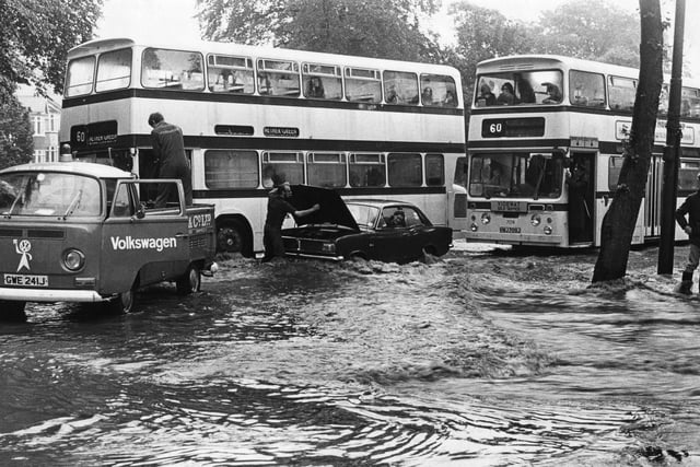 Buses and cars struggle through the floods in Sheffield - July 1973