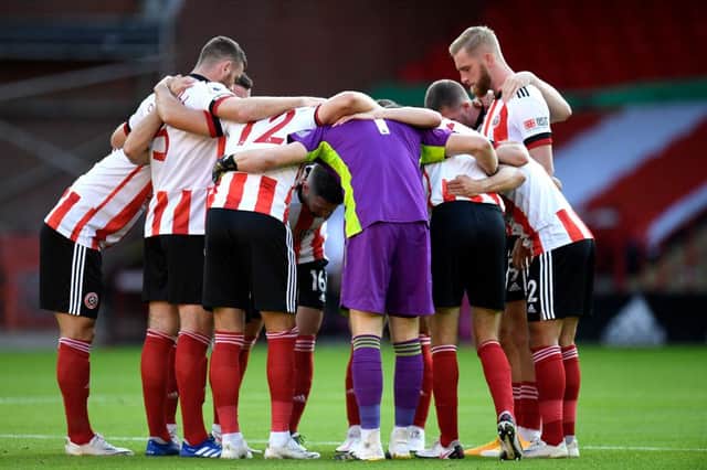 SHEFFIELD, ENGLAND - SEPTEMBER 14: Sheffield United players huddle during the Premier League match between Sheffield United and Wolverhampton Wanderers at Bramall Lane on September 14, 2020 in Sheffield, England. (Photo by Peter Powell/Pool via Getty Images)
