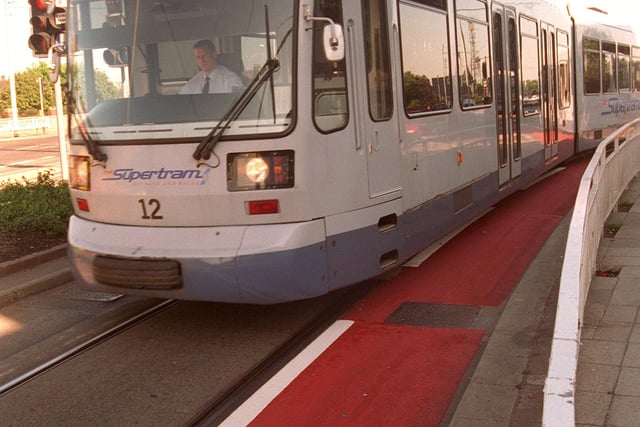 Pictured at Manor Top, Sheffield in 1997, where the new red strip and white line is seen  on Supertram track warning of slippery rails