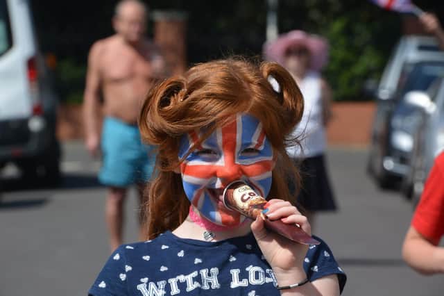 Laura Jeffrey, 7, with her face painted in Trevis Road, Southsea, at a socially-distanced street party to mark the 75th anniversary of VE Day.
