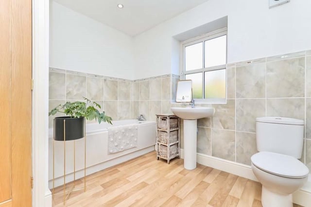 The four-piece family bathroom at Portland Street would grace any house. It comprises a bath, walk-in shower, wash basin and WC, with partly tiled walls, a hardwood floor, extractor fan and a central heating towel-rail. An opaque window faces the back.