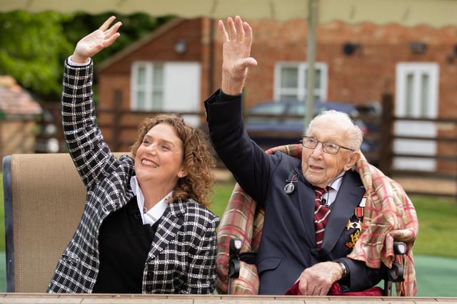 Tom and his daughter Hannah celebrate his 100th birthday, with an RAF flypast provided by a Spitfire and a Hurricane over his home on April 30, 2020. in Marston Moretaine, England. (Emma Sohl - Capture the Light Photography via Getty Images)