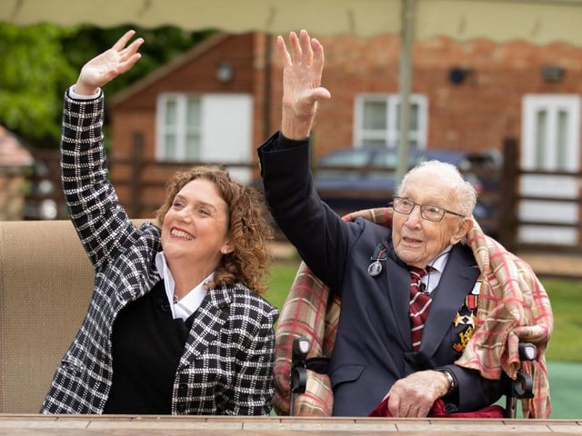 Tom and his daughter Hannah celebrate his 100th birthday, with an RAF flypast provided by a Spitfire and a Hurricane over his home on April 30, 2020. in Marston Moretaine, England. (Emma Sohl - Capture the Light Photography via Getty Images)