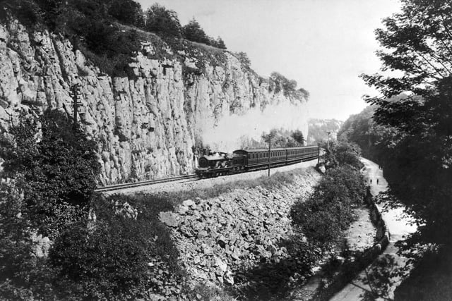 A steam train passes along the Buxton branch of the Midland Railway in Derbyshire, circa 1910