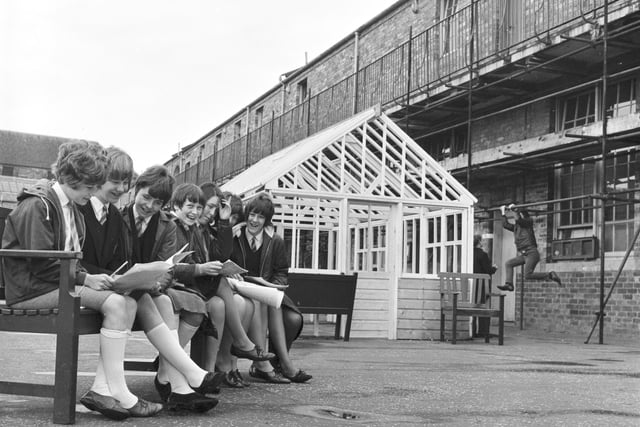 Pupils of Tynecastle Secondary School are pictured beside a greenhouse they built in June 1966.
