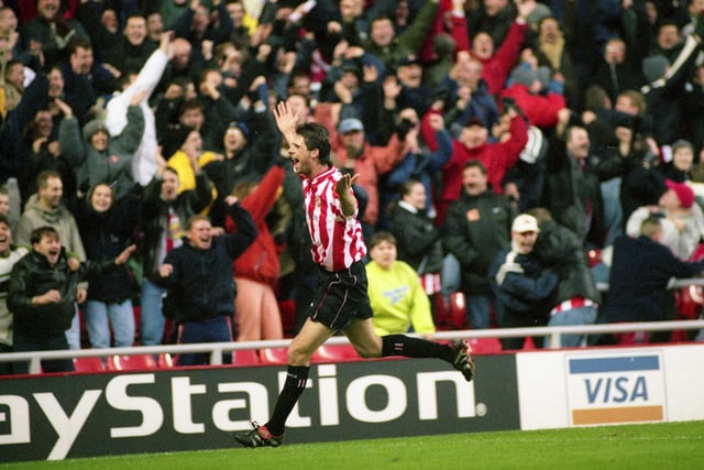 Niall Quinn celebrates scoring a goal in a 4-1 win over Chelsea at the Stadium of Light.