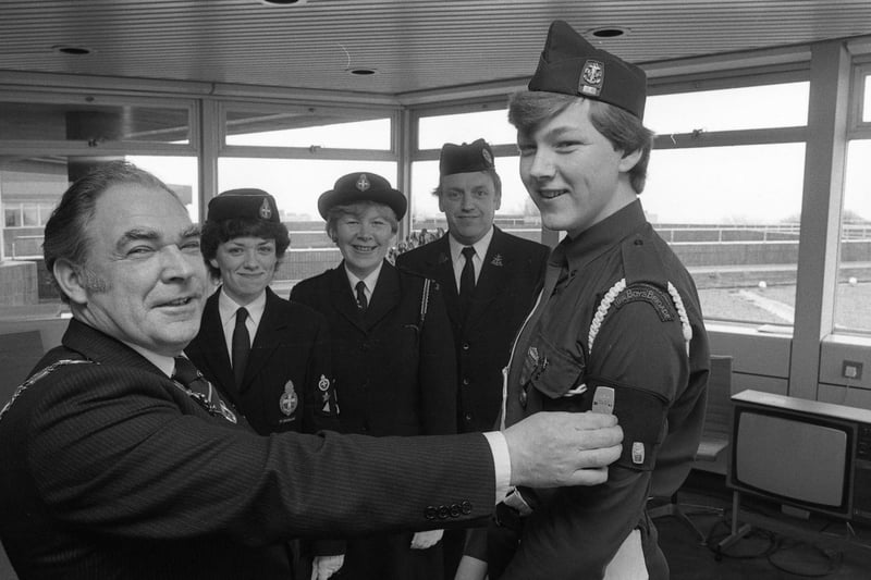 Mayor of Sunderland, Joe Hall pinned on the highest Boys Brigade award, the Queen's Badge, to Ian Hitcham, 16 of Roker in 1983. Meanwhile his father, mother and sister, Susan, 18, who are all Brigade members, looked on.