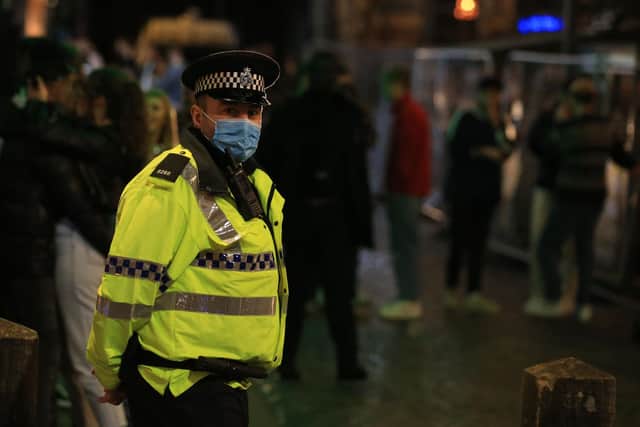 Police patrol as revellers enjoy a night out (Photo by Lindsey Parnaby / AFP) (Photo by LINDSEY PARNABY/AFP via Getty Images)