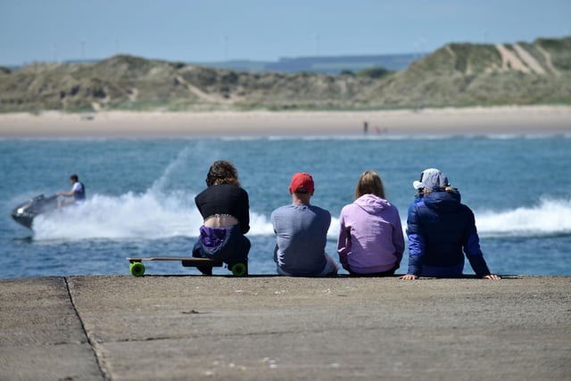 Jetskiers and skateboarders at Beadnell Beach