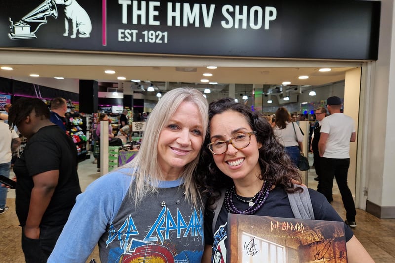 Erin Byrne of Portland, Oregon, in 1983 concert shirt, and Judy Nunez of New York with signed album. Judy said she had contributed two lost press clippings to new book Definitely: The Official Story of Def Leppard.