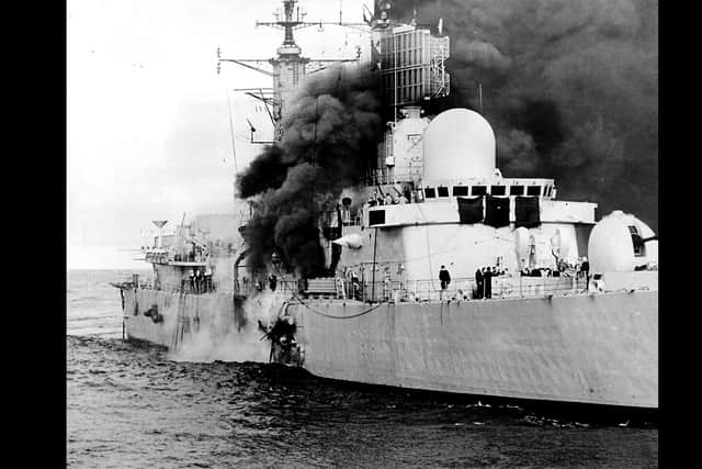 Smoke billowing from the HMS Sheffield after it was hit during the Falklands conflict