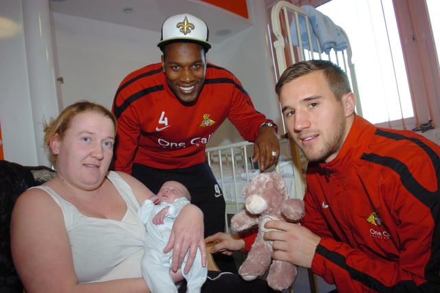 Shelton Martis, and Gary Woods deliver presents to five-week-old Kalem Reeves of Woodlands and his mum Emma in DRI during Christmas 2011.