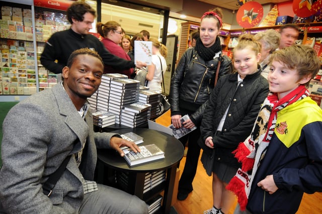 Abby Kitson, 16, from Pallion is pictured with her sister Lilli, 9, and brother Anthonie, 11, in Waterstones book store in the Bridges, They were the first in the queue to get their copies of Louis Saha's biography signed by the man himself in 2012.