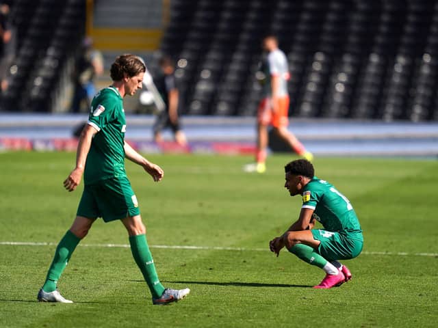 Sheffield Wednesday's Adam Reach (left) and Jacob Murphy appear dejected after the final whistle during the Sky Bet Championship match at Craven Cottage