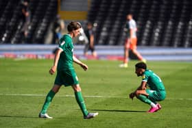 Sheffield Wednesday's Adam Reach (left) and Jacob Murphy appear dejected after the final whistle during the Sky Bet Championship match at Craven Cottage