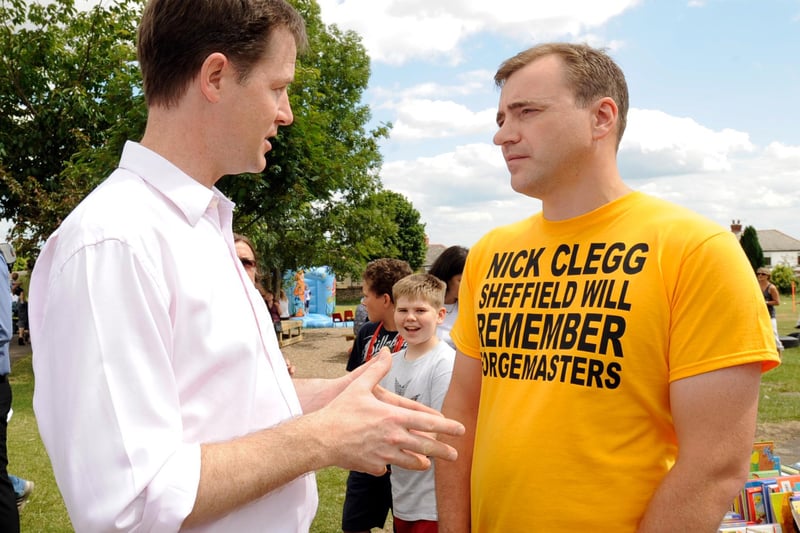 Deputy Prime Minister and Sheffield MP Nick Clegg speaking to Liam McNaughton,  wearing a Forgemasters protest T-shirt for a 10-minute discussion, when the MP opened the Ecclesall Infant School summer fete. There was widespread anger when the coalition government cancelled an £80 million loan to the firm in 2010