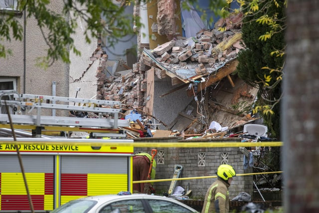 Police say four homes were caught up in the blast. Witnesses said at least one terraced house was destroyed, with those on either side of the property also damaged.