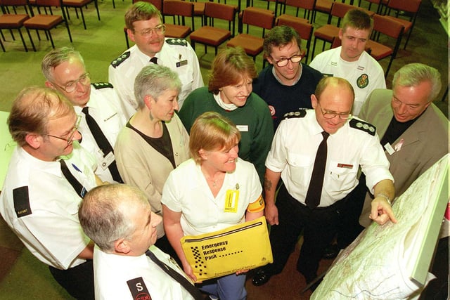 In 1998 voluntary organisations and the three emergency services got together at the Carr House Centre, Danum Road, Bennetthorpe, to discuss how they might deal with civil disaster type emergencies. Our picture shows, back row, from left, Keith Gudgin, of Raynet, Ernest Hardy, of the St John Ambulance Brigade and Chief Inspector Michael Dean, of South Yorkshire Police; middle row, Mary Harrington, of the Doncaster Samaritans, Jennifer Batchelor-Wylie, of the WRVS, Keith Davies, of the British Red Cross and paramedic John Shaw; front row, Royce Edwards, of the Salvation Army, Maureen Hall of Donmcaster Social Services, Dick Thickett, of the Fire Service and Reverend John Barnes, of Armthorpe Parish Church.