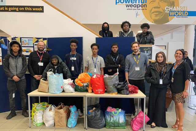 Students of Longley Park Sixth Form College with staff member Bernadette Edge who helped organise the collection, and Jed Barr of City Hearts (second from left).