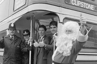 Santa Claus hitching a ride on Mansfield Brewery's free bus in 1990