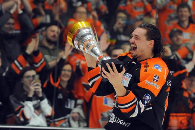 Pic: Happier times: Marco Vallerand parades the Challenge Cup at Cardiff Devils' rink, the last game before shutdown. Picture by Dean Woolley.