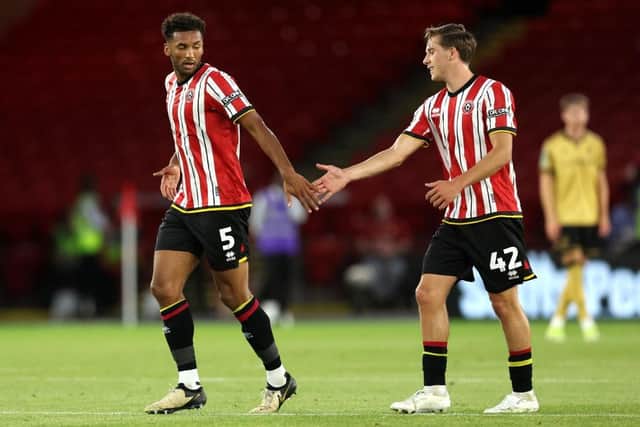 Goalscorer Auston Trusty celebrates with his Sheffield United team-mate Sydie Peck