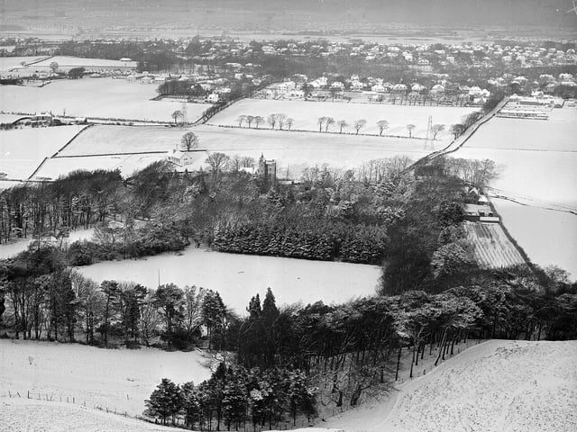 A snow covered Colinton, looking towards Bonaly Tower from the Pentlands, in January 1958.