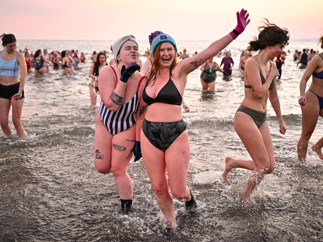 Around 700 swimmers took a sunrise dip in the North Sea at Portobello Beach. (Photo by Jeff J Mitchell/Getty Images)