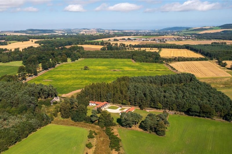 Aerial view of property and surrounding area.