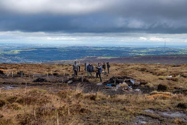 Volunteers work in difficult conditions in the search for lost WW2 American airman Corporal Clarence Watson at Twizle Head Moss Crash Site on Holme Moss near Holmfirth. Picture by Tony Johnson.