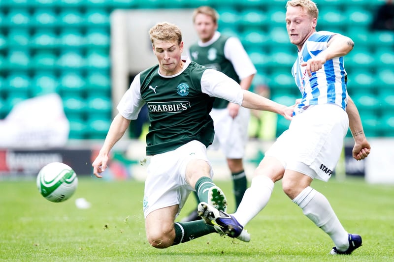 David Wotherspoon (left) challenges Tom Clarke in a 2-2 draw between Hibs and Huddersfield ahead of the 2012/13 season