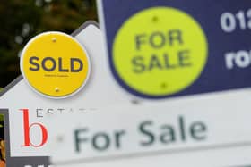 Sold and for sale signs as house prices increase again