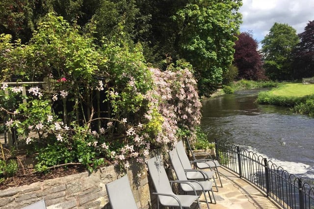This is one of the property's very special features - a seating area at the bottom of the garden right by the River Wye.