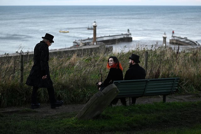 Participants in costume attend the biannual 'Whitby Goth Weekend' festival in Whitby, northern England, on October 31, 2021. - The festival brings together thousands of goths and alternative lifestyle fans from the UK and around the world for a weekend of music, dancing and shopping. (Photo by Oli SCARFF / AFP) (Photo by OLI SCARFF/AFP via Getty Images)