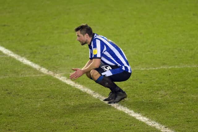 A dejected Julian Borner sinks to his knees after Sheffield Wednesday's 2-1 defeat to Rotherham United at Hillsborough on Wednesday night. Photo: Steve Ellis.