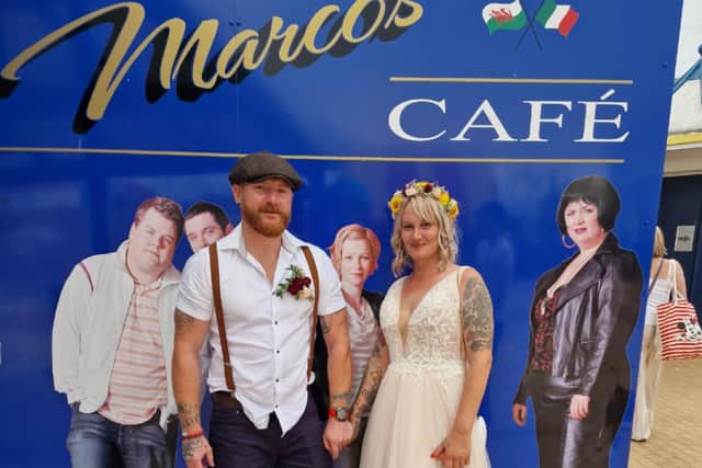 Claire and Will Baggaley outside Marco's Cafe during their Gavin & Stacey themed wedding day in Barry