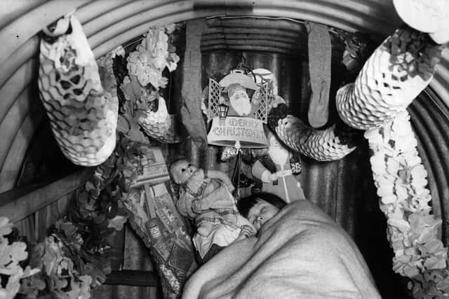 A wartime Anderson shelter festively decorated for a sleeping child's Christmas, Ilford, Essex, 14th December 1940.  (Photo by Fox Photos/Getty Images)