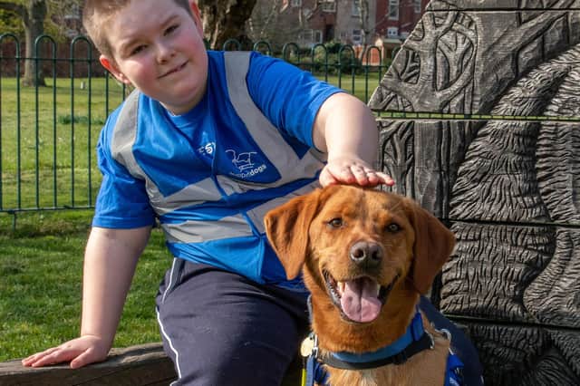 Jacob Brailsford with his assistance dog Jai Jayy. Photo: Support Dogs 