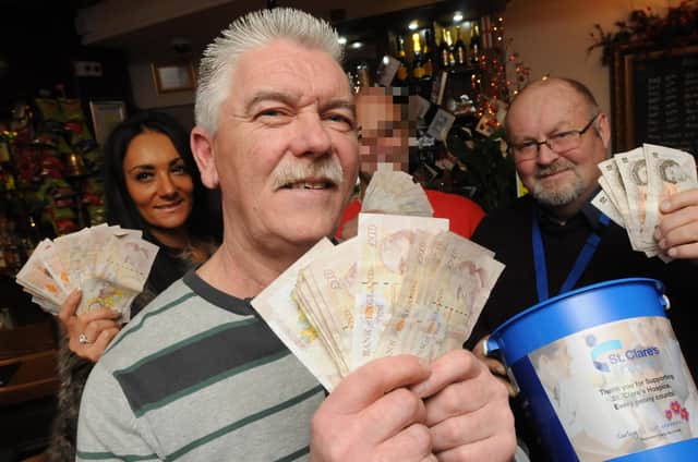 The pub backed the Movember campaign in 2014 and here's the team with the money they raised. Can you spot someone you know?