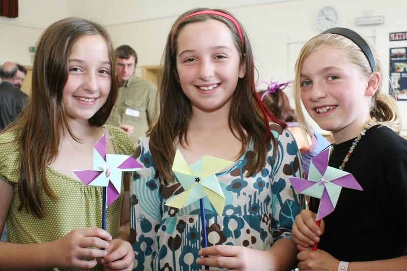 Lizzie Gould,11, Eva Gould,11, and Ella Selbie,10, with the windmills they designed at the Matlock Climate Forum meeting in the Imperial Rooms.