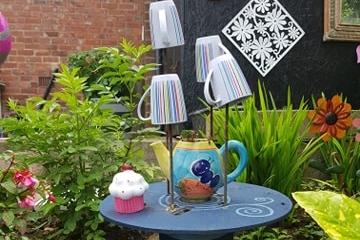 Caroline used teapots as planters and recycled old mugs for decorations.
