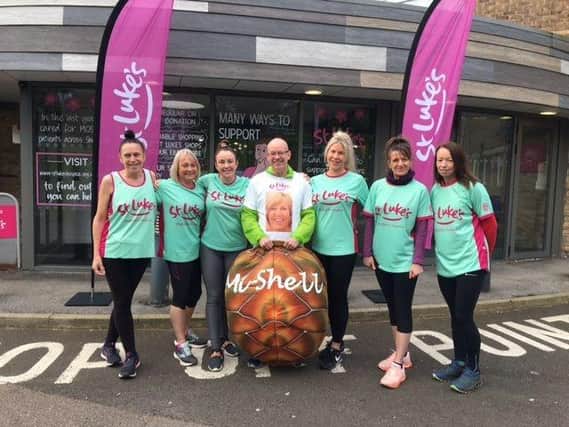 Michael, his shell and some of the supporters who will be cheering him on as he runs for St Luke's