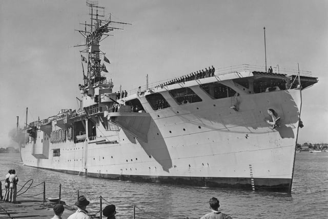 Nairana-class escort aircraft carrier HMS Campania comes into port to be readied as the command ship for Operation Hurricane, the test of the first British atomic bomb on the Monte Bello Islands off western Australia in June 1952.