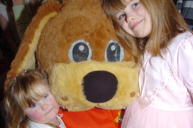 Donny Dog meets five-year-old Amy Vaughan of Thorne and seven-year-old Angela Tulloch of Woodlands at the Junior Rovers Christmas party in 2009
