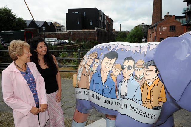Pam Colton and Niki Connolly look at an elephant outside Kelham Island, which is part of the Herd trail. Picture: Andrew Roe